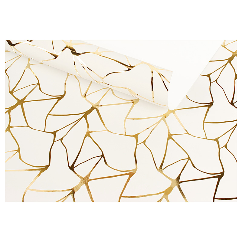 White gift wrapping paper with metallic gold design