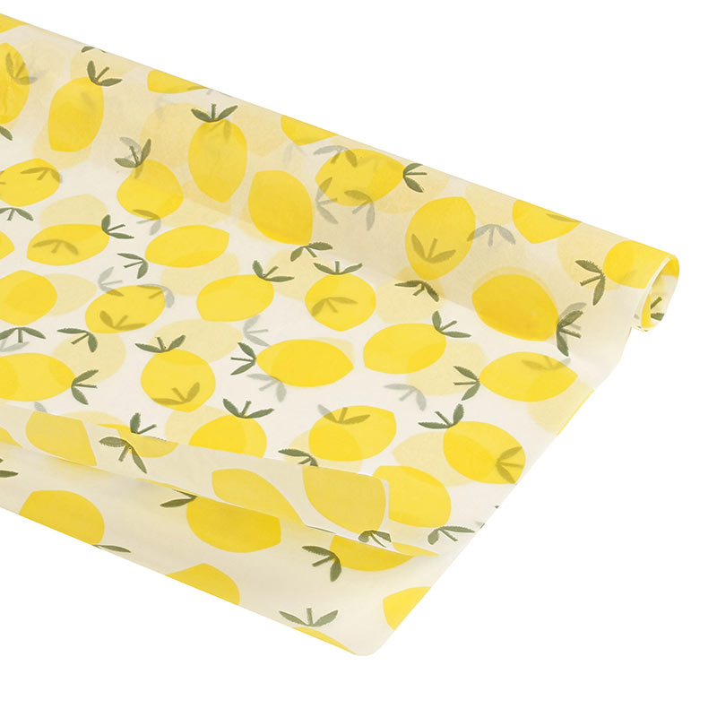 White tissue paper with yellow lemon motifs