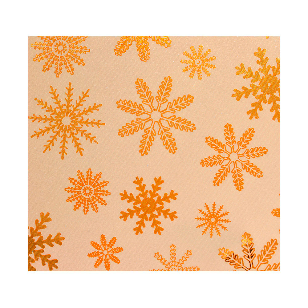 Kraft paper gift wrap decorated with shiny gold snowflakes