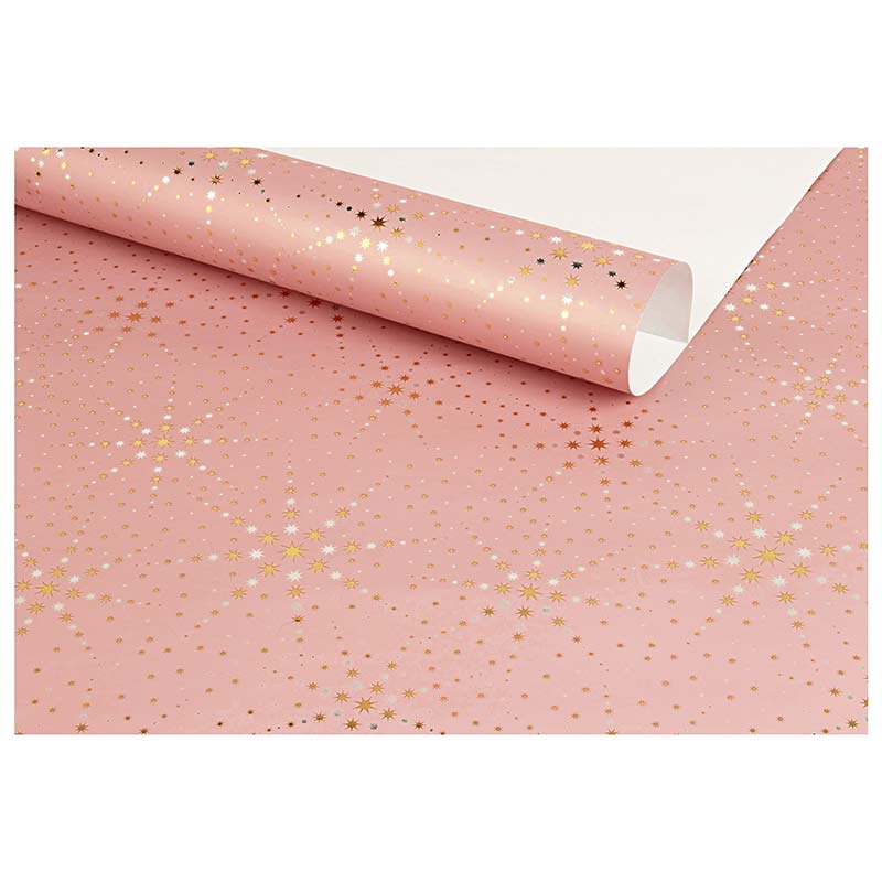 Powder pink gift wrapping paper featuring silver and gold star motifs