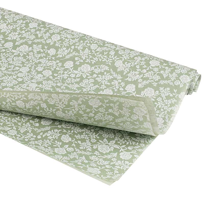 Green tissue paper with small white flower print