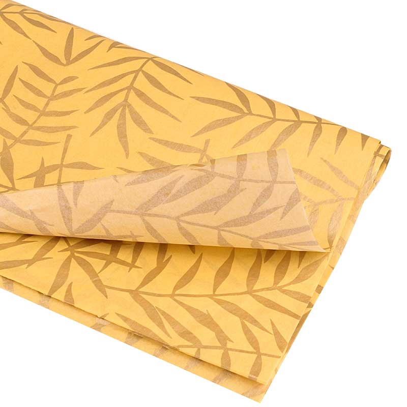 Mustard yellow background tissue paper with gold foliage motifs