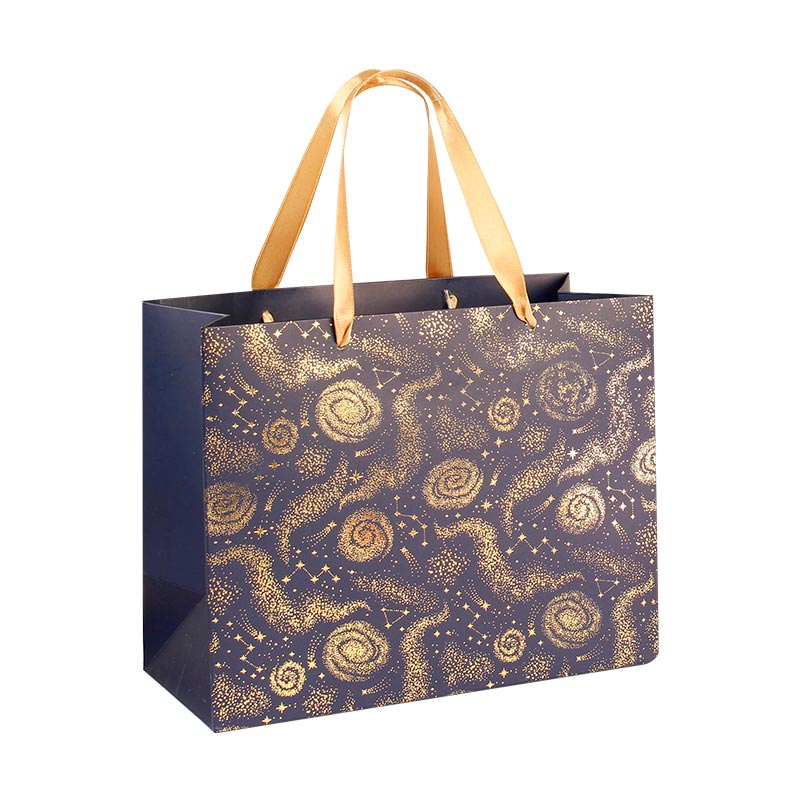 Midnight blue paper gift bags with gold hot foil printed constellation motifs, 22.7 x 10 x 18 cm H