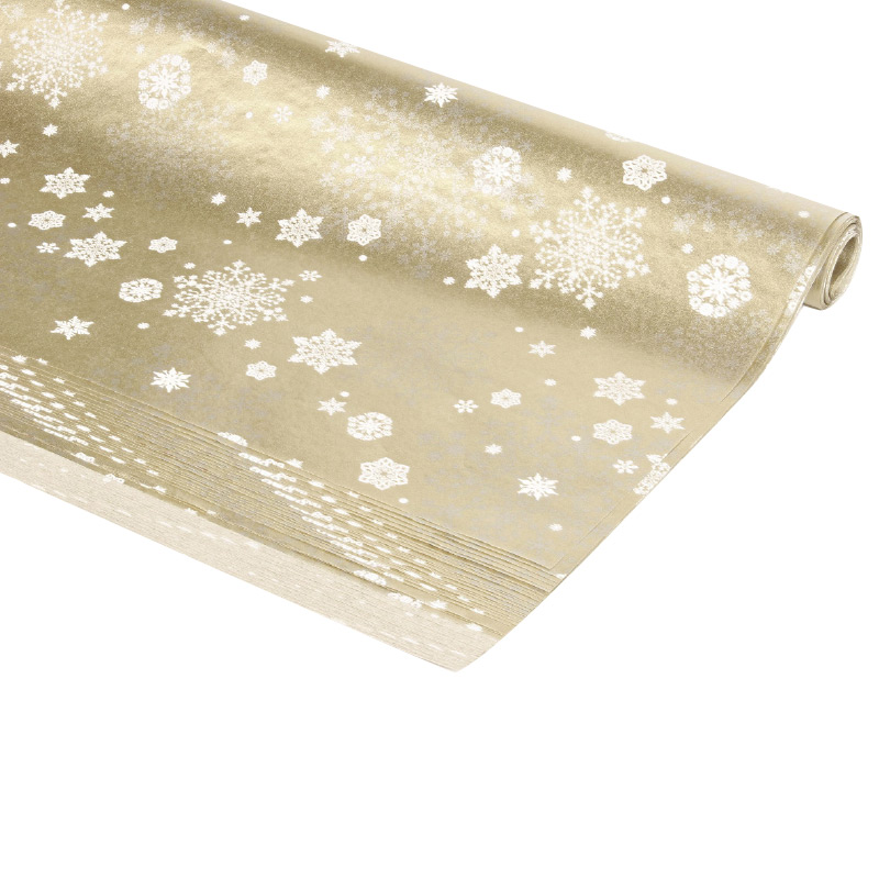 Gold-coloured tissue paper with white snowflake motifs