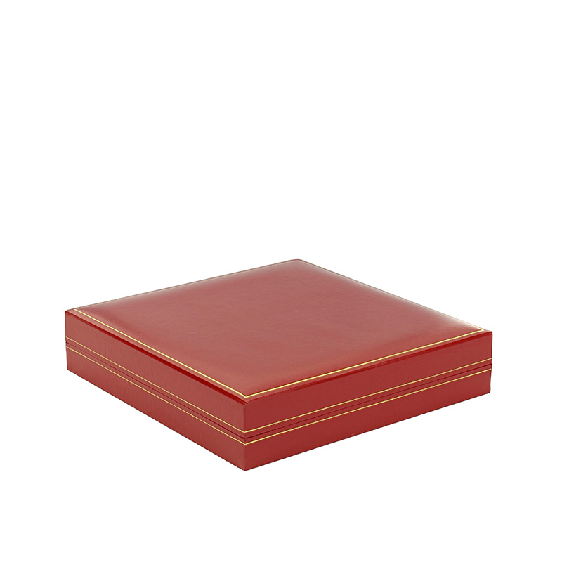 Red man-made leatherette box for a jewellery set with a gold border