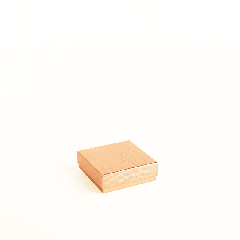 Textured and smooth shiny gold-coloured card ring/universal box