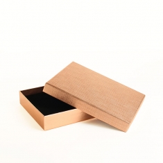 Textured and smooth shiny gold-coloured card ring/universal box