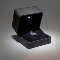 Leatherette earrings/pendant box with LED lighting and topstitching