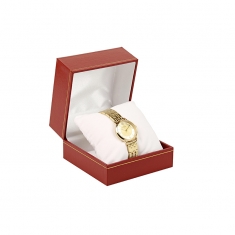 Red leatherette watch box with a gold border