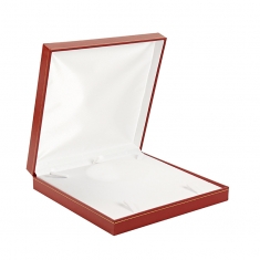 Red man-made leatherette box for a jewellery set with a gold border
