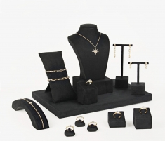 T-shaped earring display stand covered in black man-made suedette