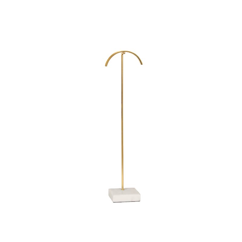 Curved necklace display stand in gold coloured metal with marble base