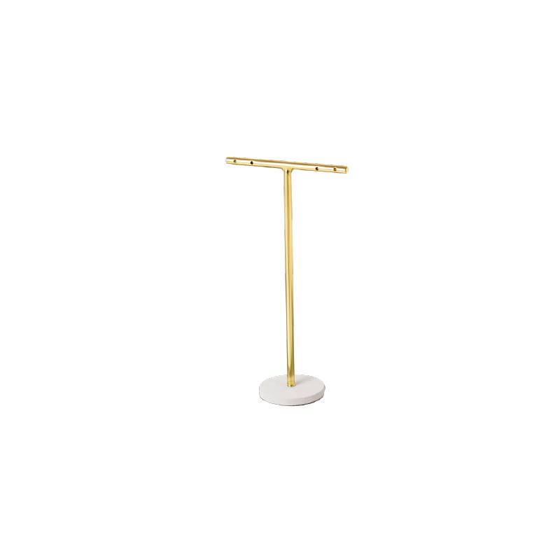 Matt gold-coloured metal T display for a pair of earrings, round white granite look base