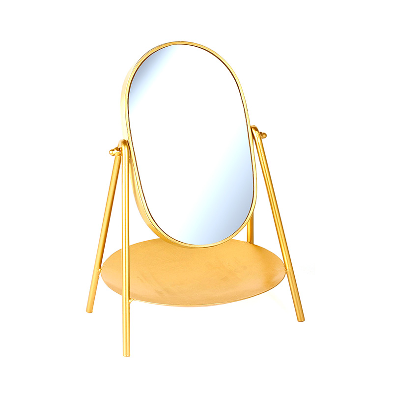 Matt gold-coloured metal oval standing mirror with shelf