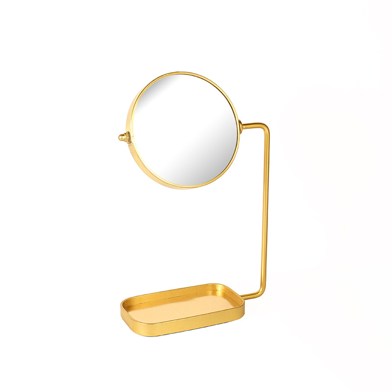 Matt gold-coloured metal round standing mirror with tray base