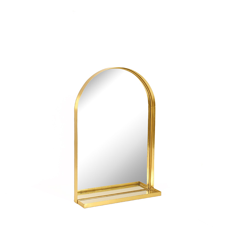 Rounded wall mirror with small shelf, gold-coloured metal, 26 x H 38cm