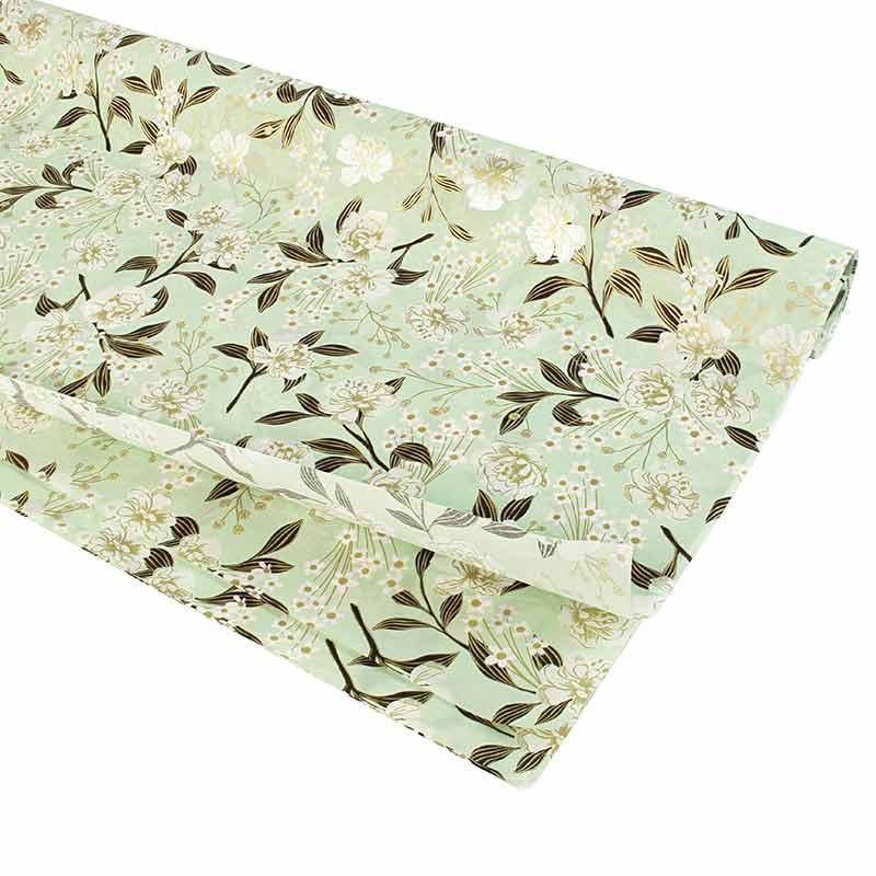 Mint green coloured tissue paper with floral print