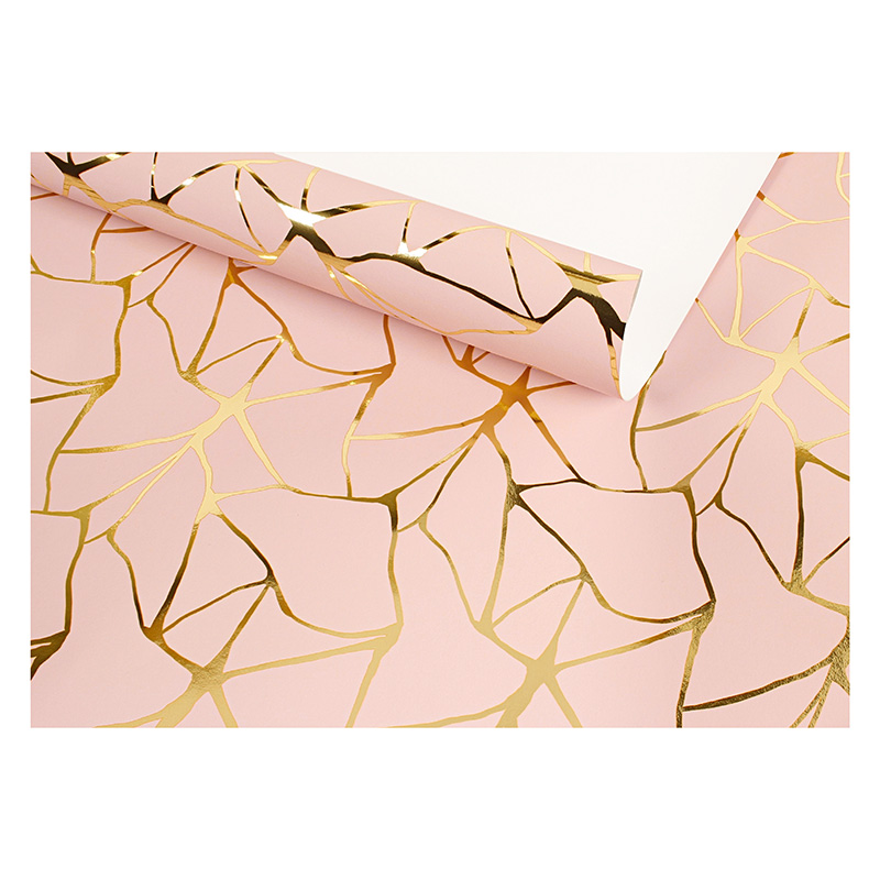 Pink gift wrapping paper with metallic gold design