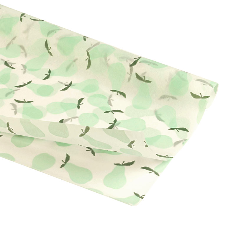 White background tissue paper with mint-green coloured pear motifs