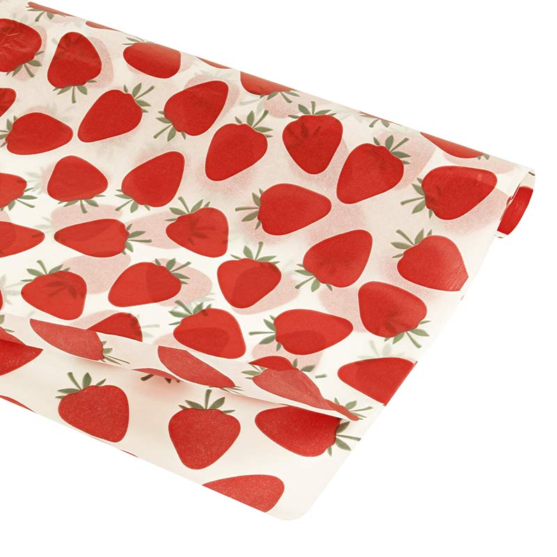 White background tissue paper with red strawberry motifs