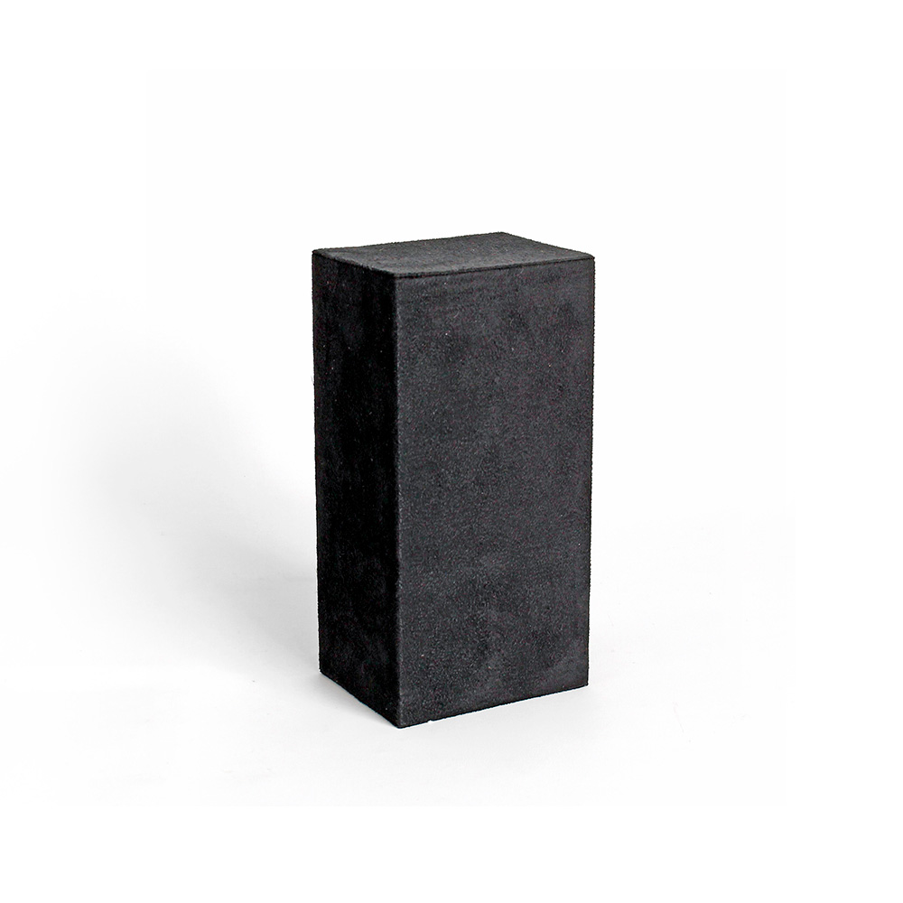 Display riser covered in black man-made suedette 9 x 7 x 18cm
