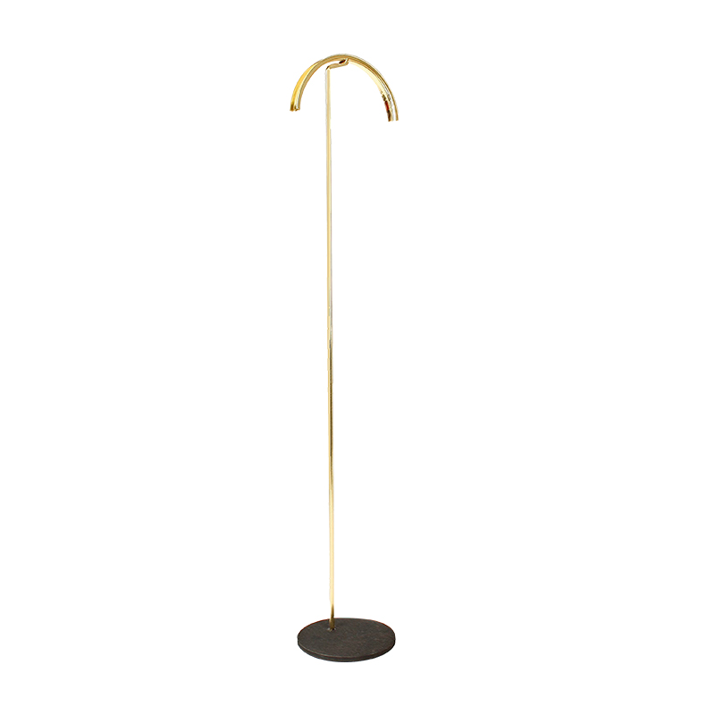 Shiny brass-coloured metal curved necklace display with round black granite finish base, 57 cm tall