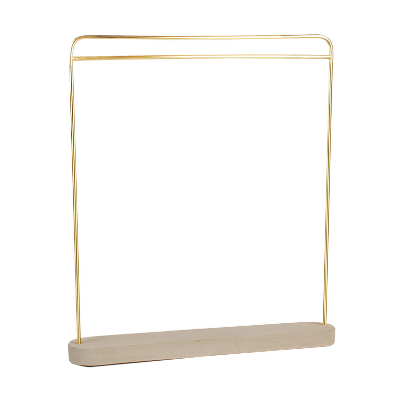 Gold-coloured metal necklace and chain display stand with concrete base 38 cm tall