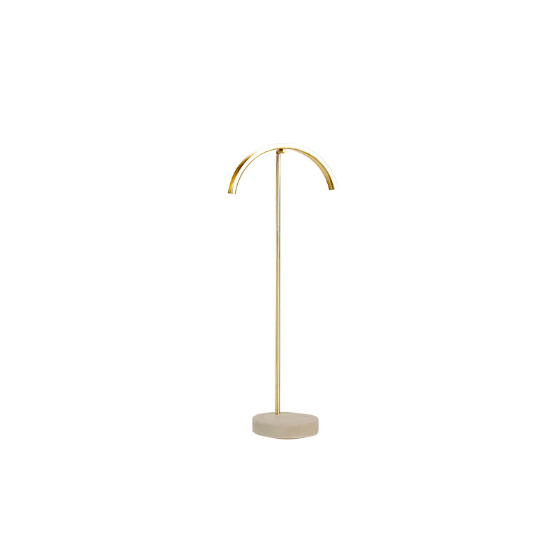 Matt finish gold-coloured metal necklace stand with curved top, concrete base, 29 cm tall