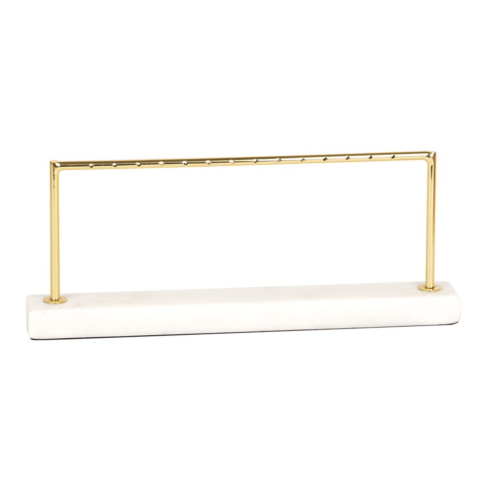 Gold-coloured metal earring display rack with marble base