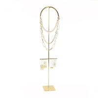 Gold-coloured metal display for necklaces and 4 pairs of earrings H 57cm