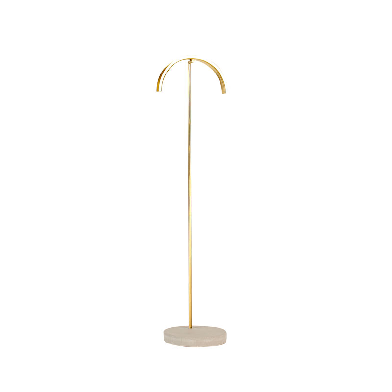 Matt finish gold-coloured metal necklace stand with curved top, concrete base, 29 cm tall